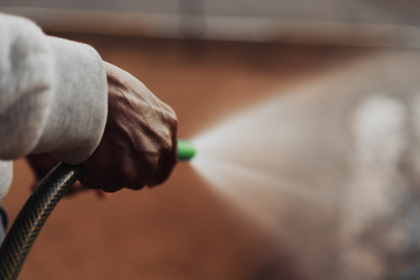 Close-up of a pressure washing nozzle spraying